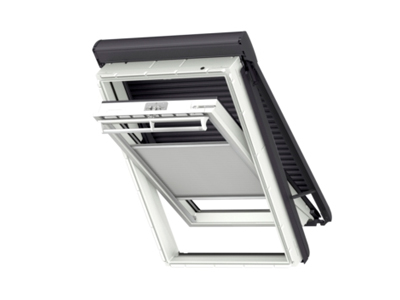 An angled view of a Velux roof window with its open pane and integrated blind.